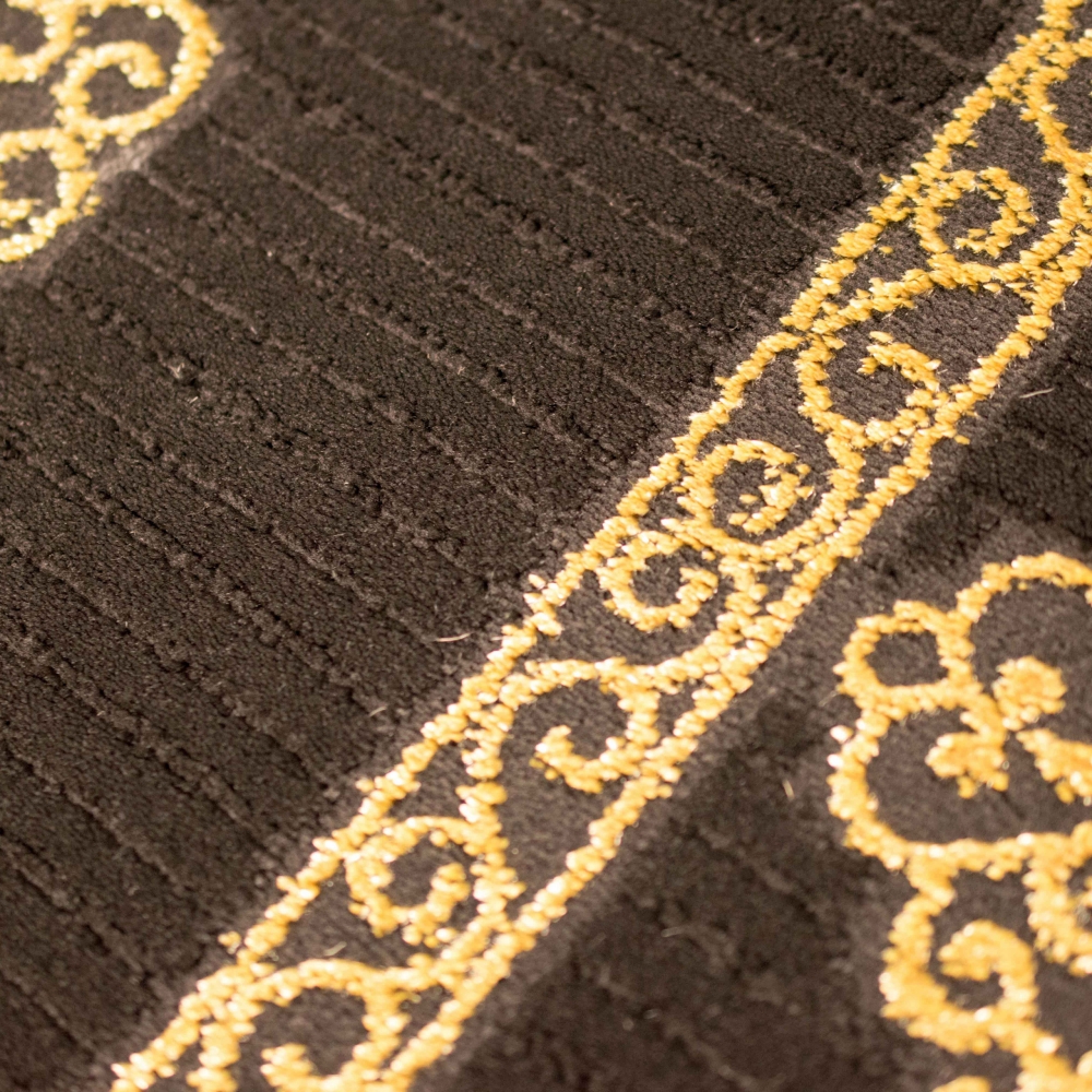 Wohnzimmerteppich Ornamente in schwarz gold